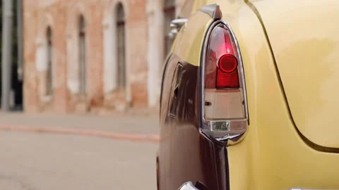 Close up view of taillight of old retro vintage car in beige and burgundy colors Stock Footage 156699348