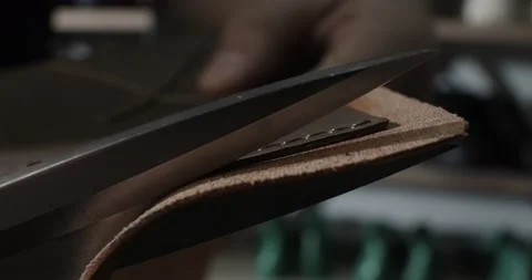 Close up view of tailor cut leather with scissors preparing blanks for making Video stock 200127267