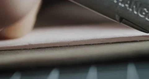 Close up view of tailor cuts leather piece with knife preparing blanks for Video stock 200127029