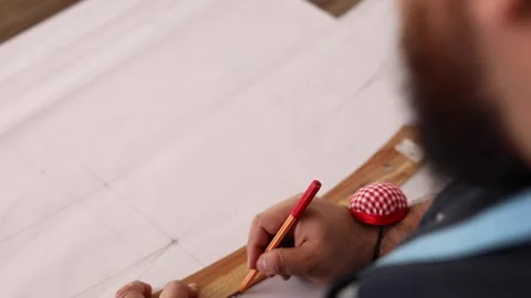 Close up view of tailor drawing template for dress Stock Footage 199381584