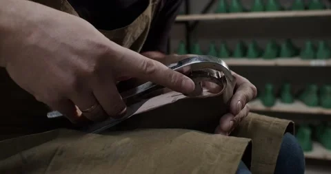 Close up view of tailor nailing and fixing blank for shoes in private leather Stock Footage 200127655