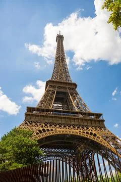 A close-up view of the tall structure of the Eiffel tower during the day Stock Photos