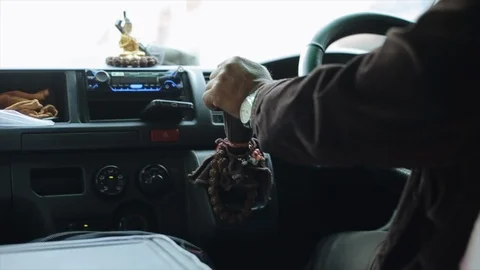A close view on taxi drivers hands in East Asia Nepal, Kathmandu. Buddhist Stock Footage 126910860