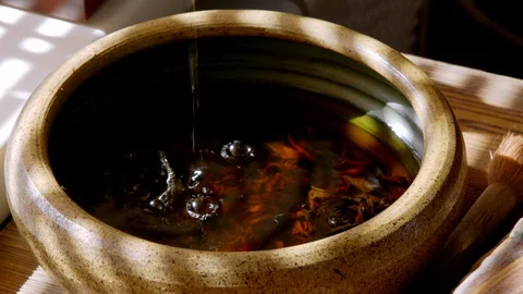 Close up view of tea pouring in tea bowl Stock Footage 129284747