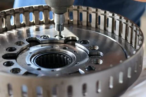 Close Up View Of Technician Using Impact Wrench On Mechanical Drum. Stock Photos