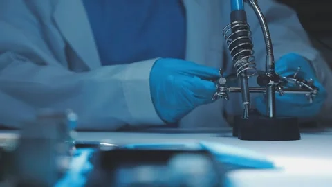 A close-up view of a technician wearing black gloves holding a computer pro.. Stock Footage 335105409