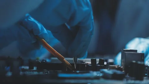 A close-up view of a technician wearing black gloves holding a computer pro.. Stock Footage 335105433
