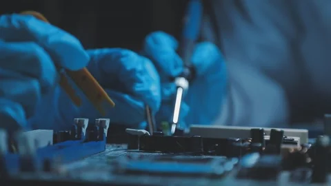 A close-up view of a technician wearing black gloves holding a computer pro.. Stock Footage 335105464