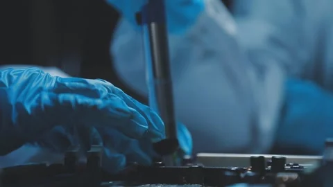 A close-up view of a technician wearing black gloves holding a computer pro.. Stock Footage 335105540