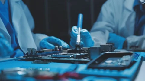 A close-up view of a technician wearing black gloves holding a computer pro.. Stock Footage 335105575