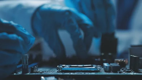 A close-up view of a technician wearing black gloves holding a computer pro.. Stock Footage 335105587