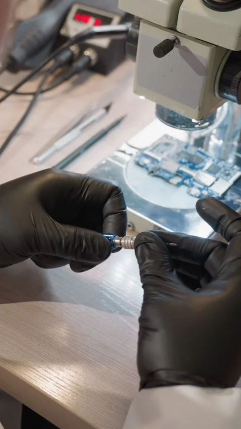 Close View of Technician Working on Circuit Board Under Microscope Stock Footage 310489860