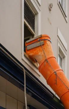 Close View of Temporary Construction Chute Mounted on Facade Stock Photos