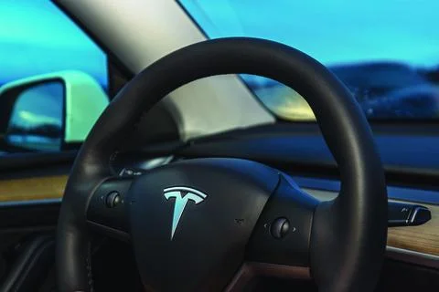 Close-up view of Tesla Model Y steering wheel featuring Tesla logo Stock Photos