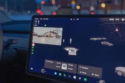 Close up view of Tesla Model Y dashboard screen with navigation and rear camera Fotos de archivo