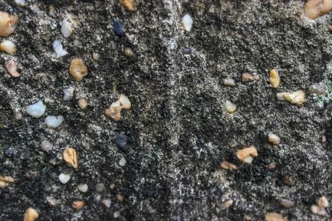 A close-up view of the texture of a concrete pillar on a house. Stock Photos