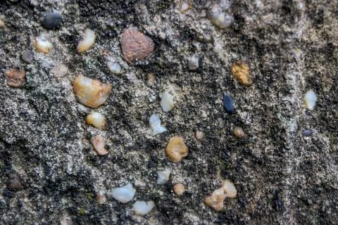 A close-up view of the texture of a concrete pillar on a house. Stock Photos