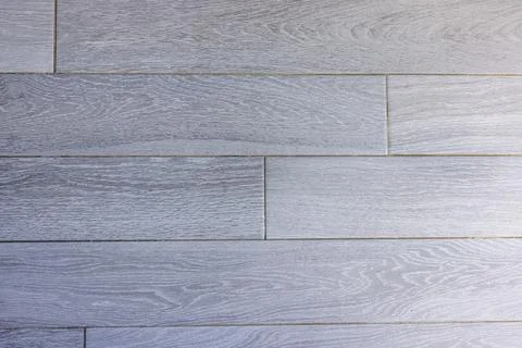 Close-up view of the texture of the rectangular gray tiled floor in a hotel. Stock Photos