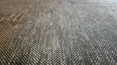 Close-up view of a textured fabric surface showcasing a woven pattern. Ideal for Foto stock