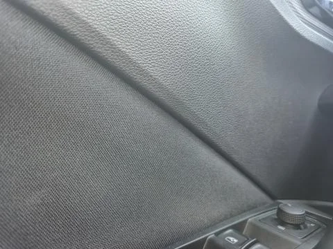 Close-up view of the textured interior surface of a vehicle showing fabric and 库存照片