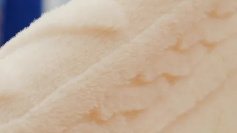 Close view of textured orange and white striped fabric, great for sewing and Stock Footage 278915997