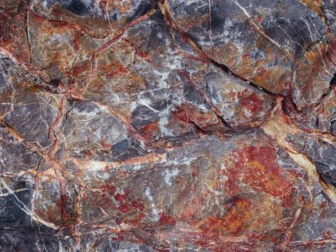 Close-up view of textured rock surface showcasing vibrant colors and intricat Stock Photos