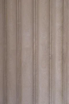 Close view of textured stone columns showing details of grooves and pattern.. Stock Photos