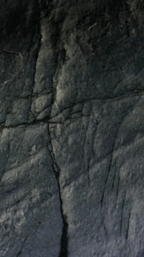 Close up view of textured stone surface with visible cracks and lines Stock Footage 335975354