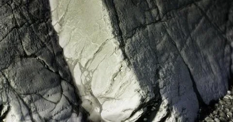 Close up view of textured stone surface revealing natural patterns and colors Stock Illustration