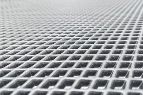 Close view of a textured surface with a grid pattern showing small square Stock Photos