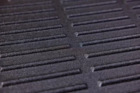 Close view of a textured surface with parallel lines and grooves during daylight Stock Photos