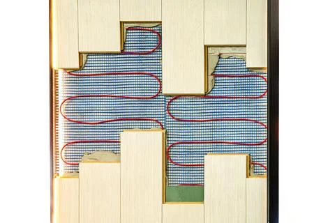 Close-up view of a textured surface with vertical blue rectangles and red squ Stock Photos