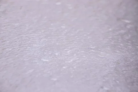 Close-up view of textured white surface with subtle patterns and variations.. 스톡 사진