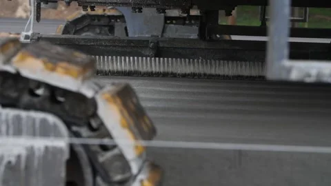 Close-up view of texturing broom for transverse tining on concrete road surface Stock Footage 158049739