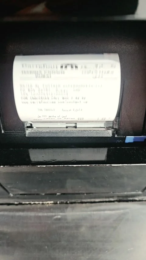 Close-up view of a thermal receipt printing from a POS transaction terminal Video stock 345930061