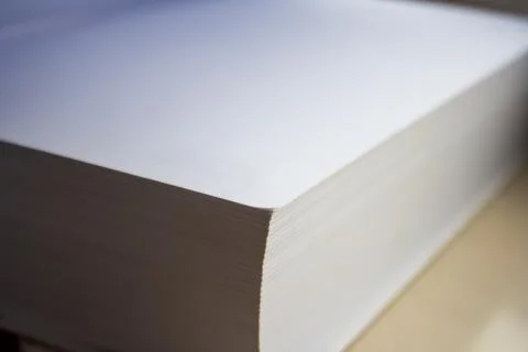Close-up view of a thick stack of white, blank paper with a smooth edge, ideal Stock Photos