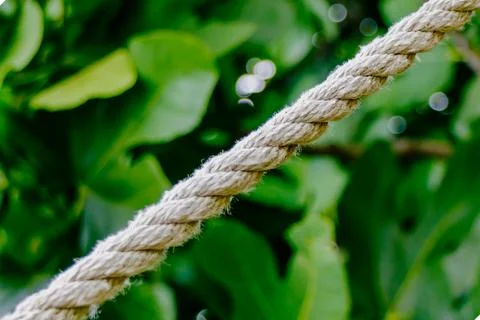 Close up view of thick twisted rope extending from upper left to lower righ.. Stock Photos