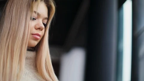 Close up view of thoughtful attractive young blonde woman in trendy outfit Video stock 104564378