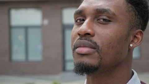 Close up view of thoughtful look of afro american. Face emotions deep eyes. Video stock 161347285
