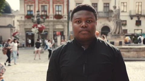 Close up view of a thoughtful young Afro-American man in a black formal shirt Stock Footage 92696411