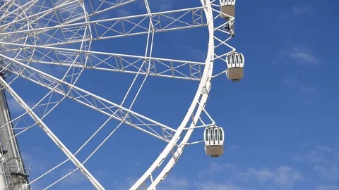 Close up`view of three cabins of a big ferris wheel turning slowly Stock Footage 106329003