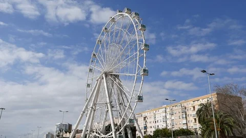 Close up`view of three cabins of a big ferris wheel turning slowly. Stock Footage 106329615