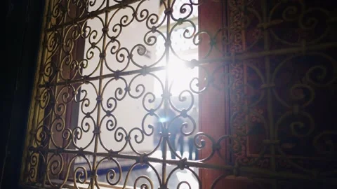Close Up View Through Ornate Iron Window Grille in Traditional Moroccan Stock Footage 345967694