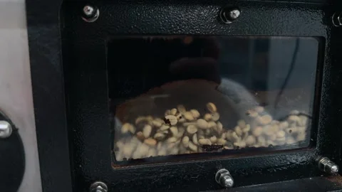 Close up View through a Small Sight Glass of Green Coffee Beans Roasting an.. 스톡 동영상 332155586