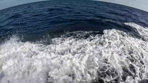 A close-view of Tidal waves captured from the boat over the deep blue waves, Stock Footage 295907530