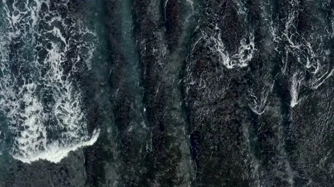 Close up view of tidal waves coming ashore in Bali Stock Footage 133303346