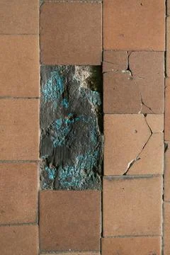 Close-up view of a tiled surface showcasing cracked ceramic tiles alongside a Stock Photos
