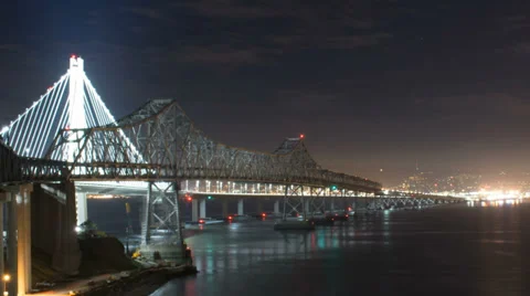 Close view time lapse of the new span of the San Francisco Bay Bridge at night Stock Footage 39594022