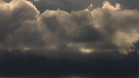 Close view time lapse of stormy clouds crossing the west horizon, over the ea Stock Footage 301219516