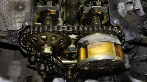 Close-Up View of Timing Chain and Gear System on Car Engine During Auto Repair Stock Footage 346411515